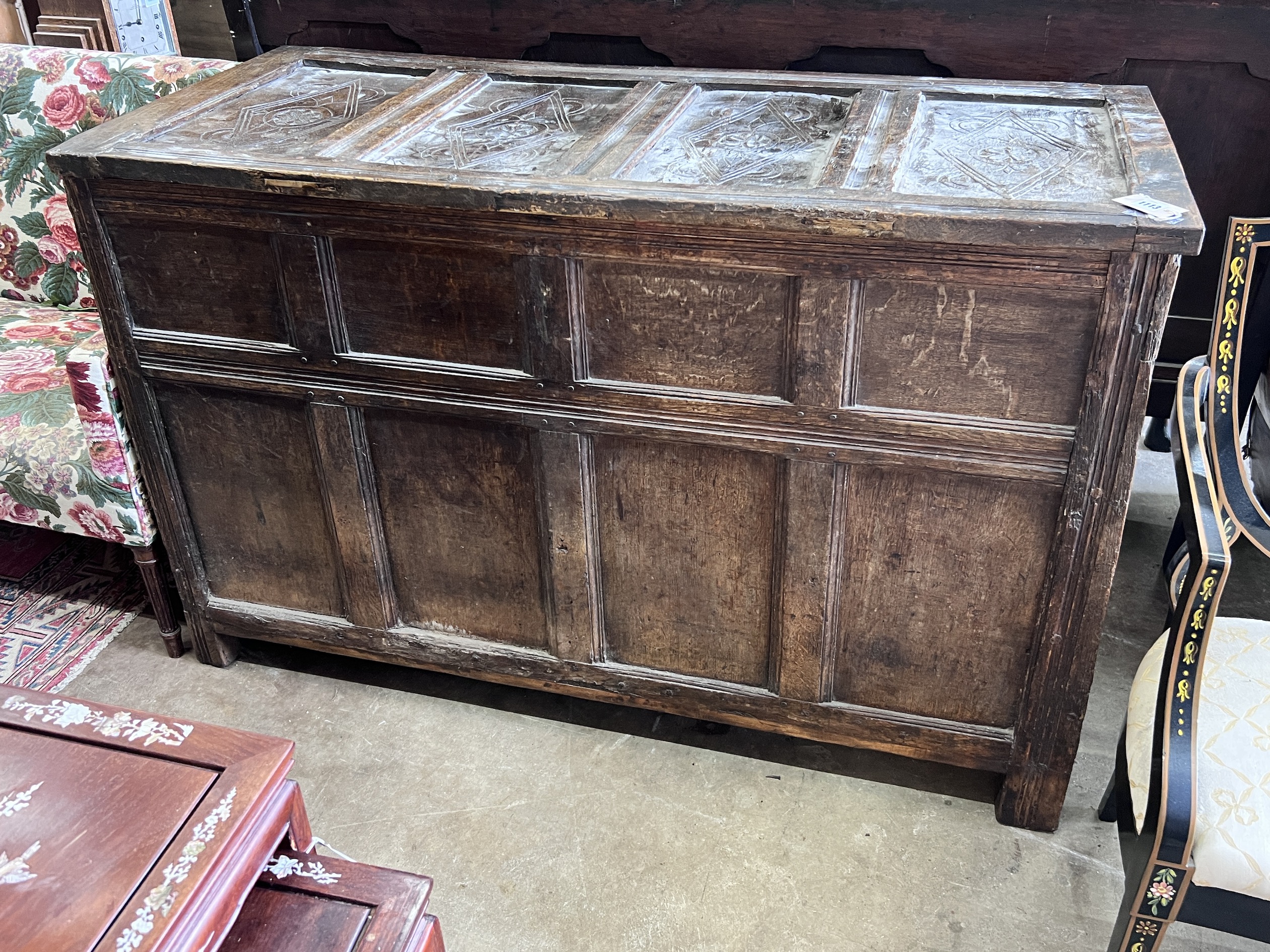 An 18th century panelled oak coffer, length 140cm, depth 61cm, height 92cm